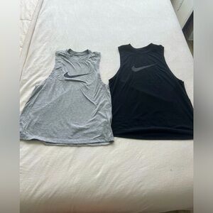 Pair of Nike work out tanks - size medium